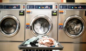laundry room needing plumbing repair by Houston multi-family commercial plumbing services