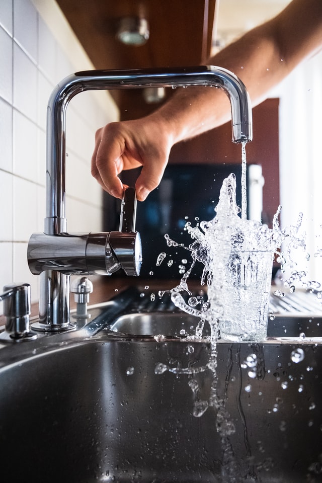 faucet with extremely high water pressure causing splash in glass, need a Houston commercial plumber to reduce the water pressure.