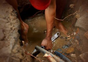 AAA Plumber providing Houston commercial plumbing repair for a sewer line
