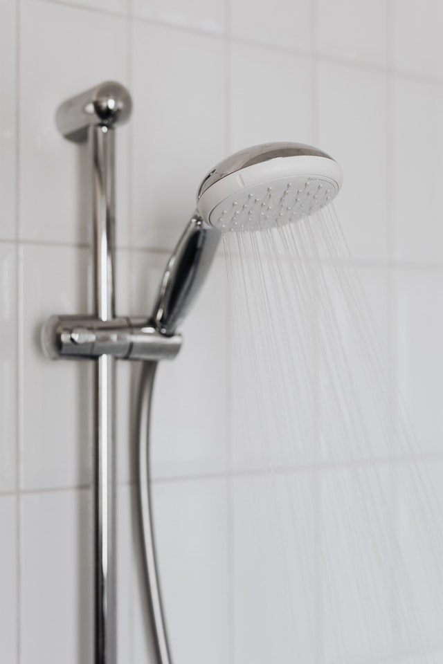 shower head providing cold water because property needs Houston commercial plumbing company to fix water heaters