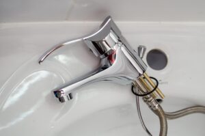 dismantled faucet for repair from Houston commercial plumbing company